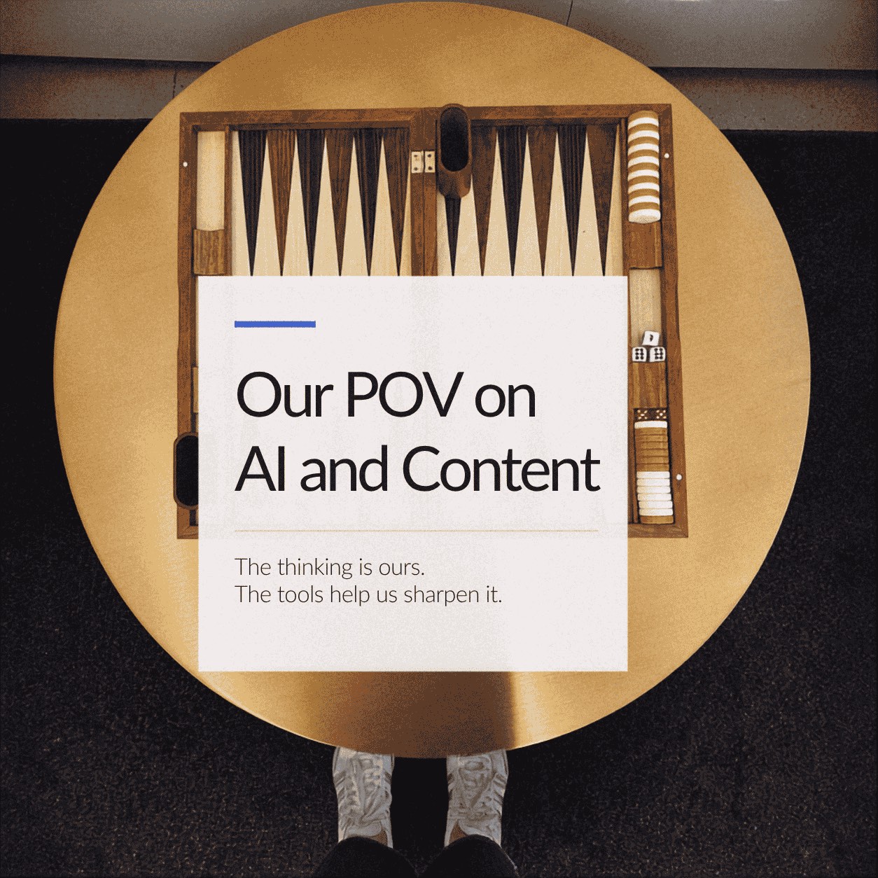 A backgammon board on a round brass table, overlaid with a card reading: Our POV on AI and Content. The thinking is ours. The tools help us sharpen it.